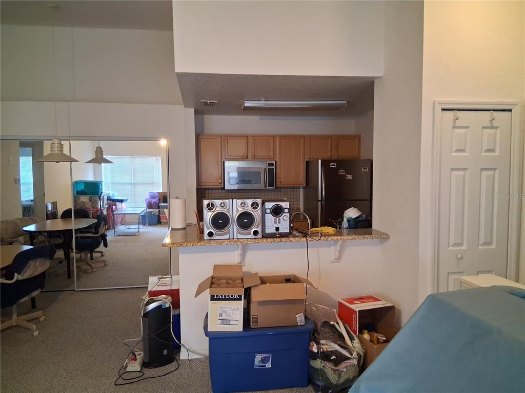 2763 Lighthouse Cove Road, Unit 6204 Orange City, FL 32763 - Photo 11 of 15 a room with furniture a rug and gym equipment