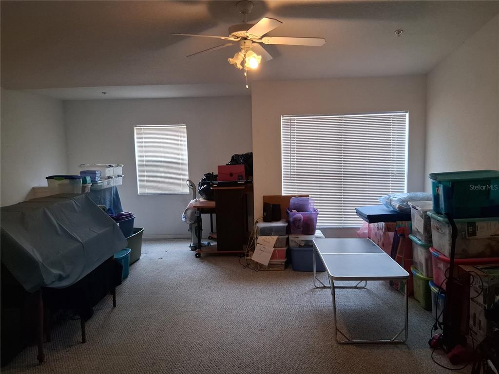 2763 Lighthouse Cove Road, Unit 6204 Orange City, FL 32763 - Photo 6 of 15 a living room with furniture and a flat screen tv