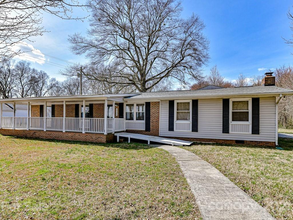 515 Sikes Mill Road Monroe, NC 28110 - Photo 2 of 33 a front view of a house with yard and seating space