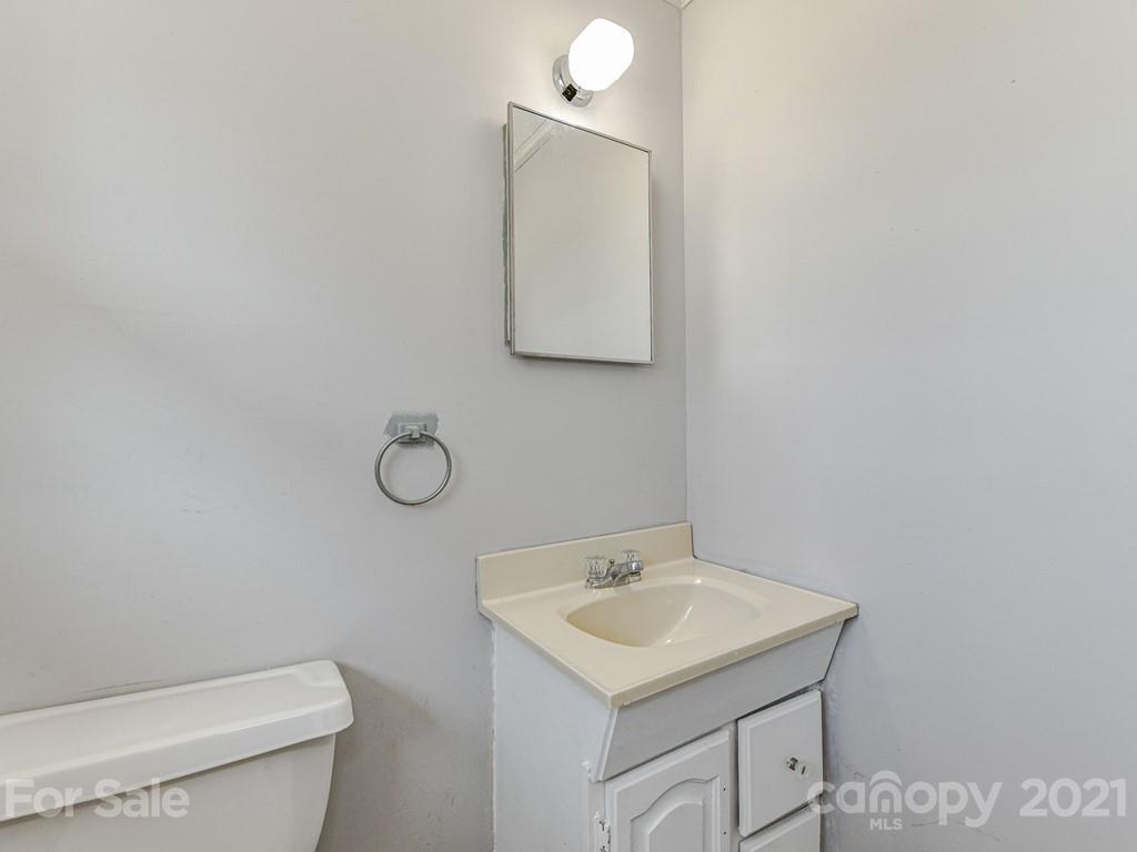 515 Sikes Mill Road Monroe, NC 28110 - Photo 22 of 33 a bathroom with a sink toilet and mirror