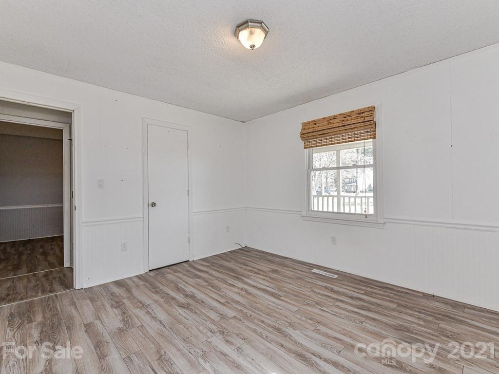 515 Sikes Mill Road Monroe, NC 28110 - Photo 24 of 33 wooden floor in an empty room with a window