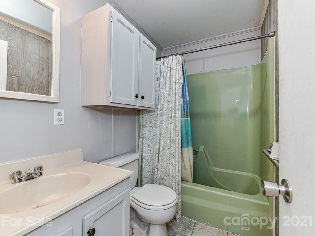 515 Sikes Mill Road Monroe, NC 28110 - Photo 25 of 33 a bathroom with a sink toilet and shower