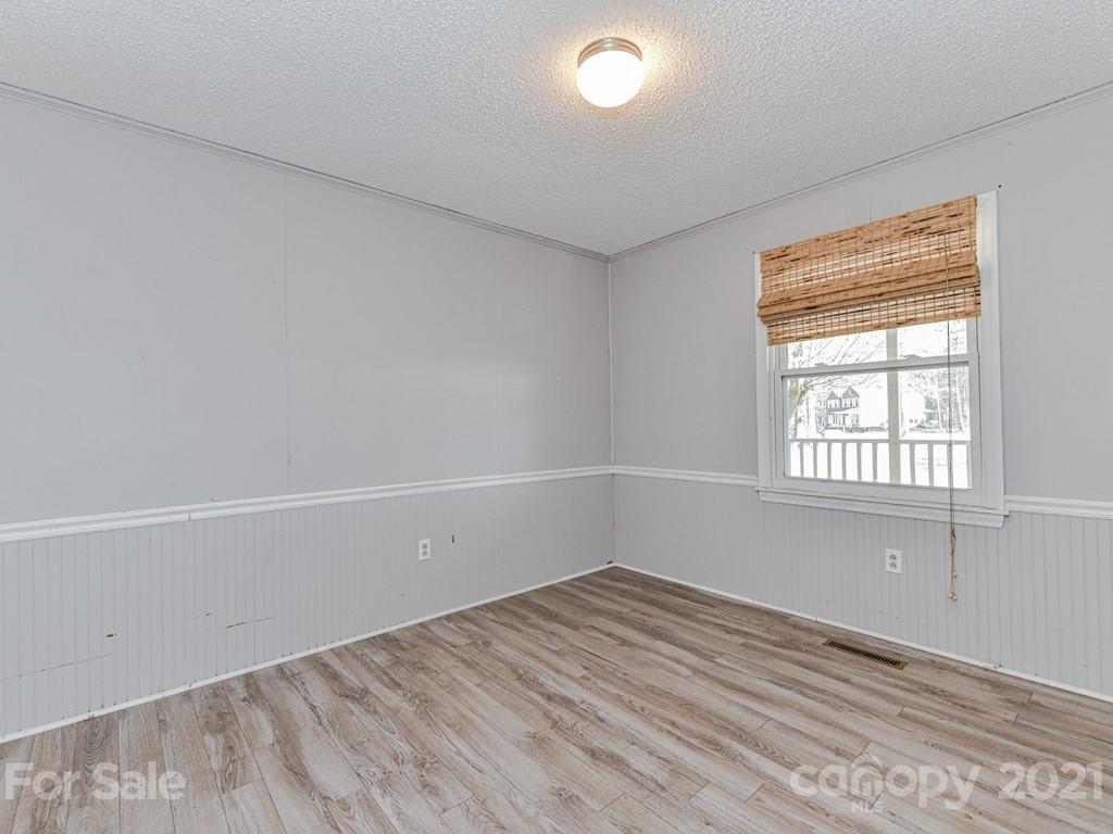 515 Sikes Mill Road Monroe, NC 28110 - Photo 26 of 33 an empty room with a window