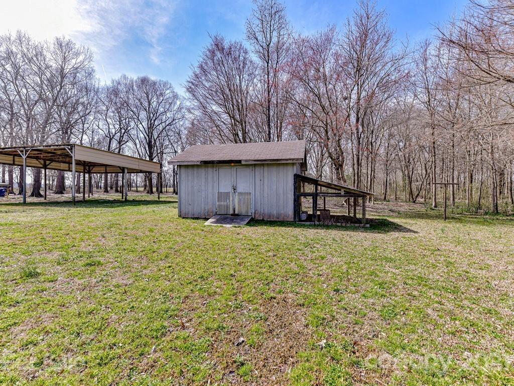 515 Sikes Mill Road Monroe, NC 28110 - Photo 28 of 33 a view of a house with a yard and garage