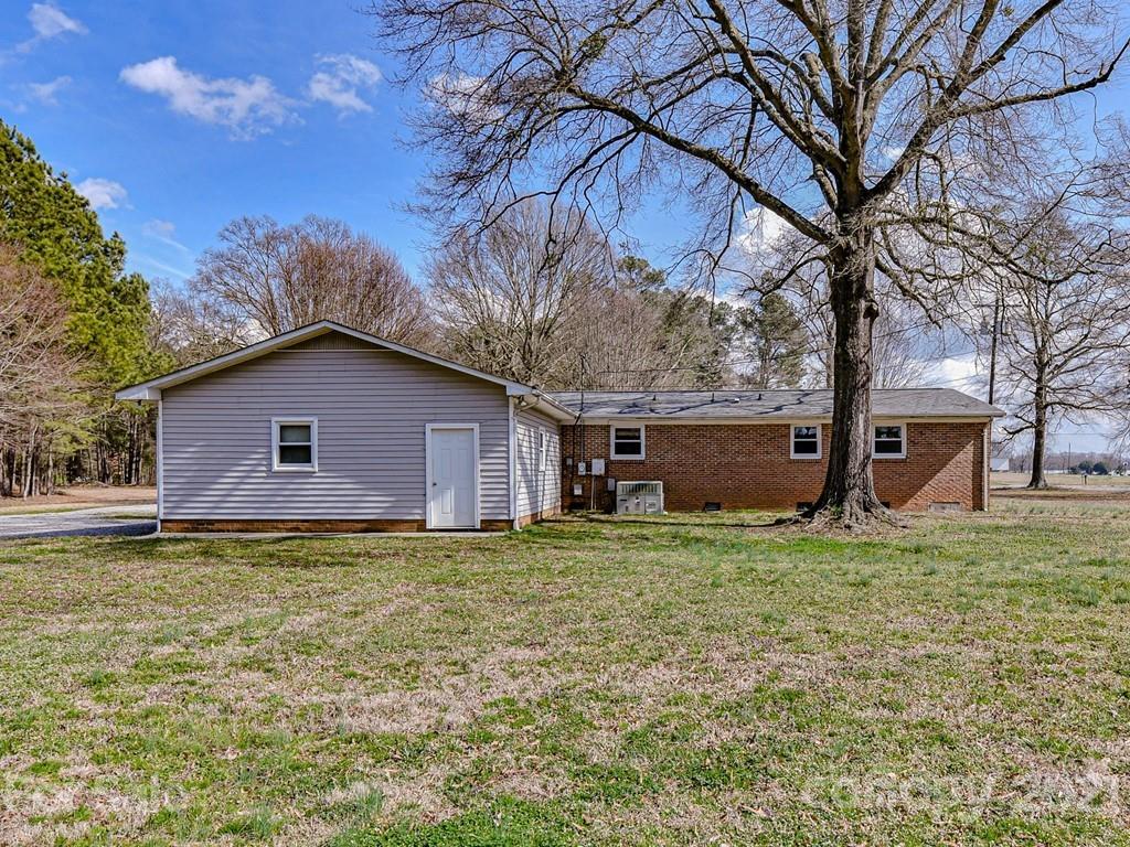 515 Sikes Mill Road Monroe, NC 28110 - Photo 31 of 33 a house view with a garden space