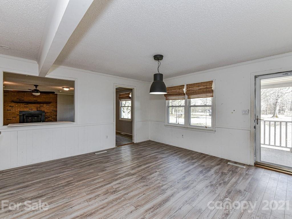 515 Sikes Mill Road Monroe, NC 28110 - Photo 6 of 33 wooden floor in an empty room with a window