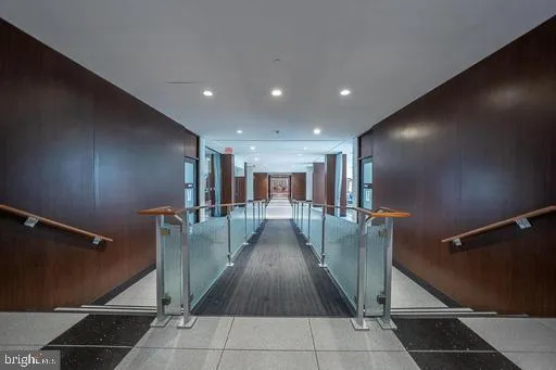 a view of a hallway with seating area