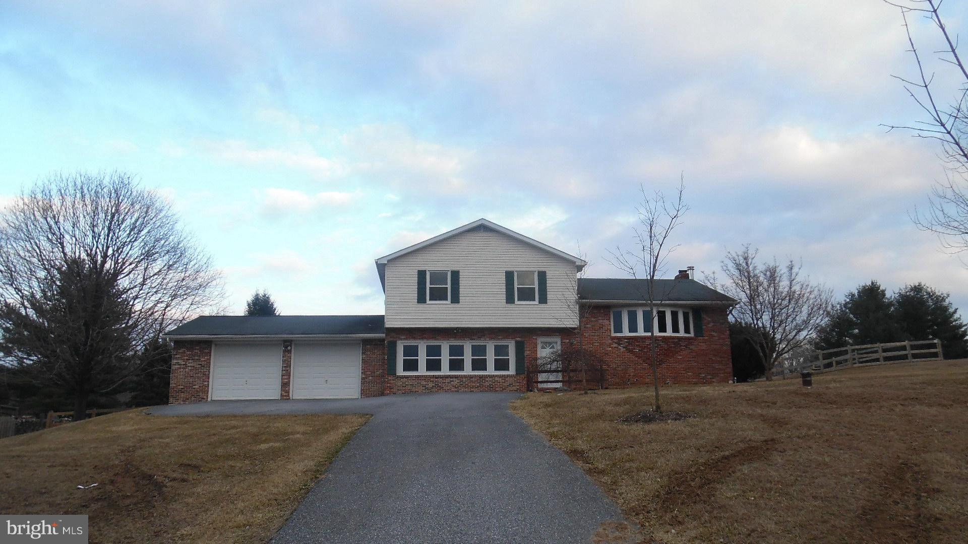 17913 Marshall Mill Road Hampstead, MD 21074 - Photo 1 of 16 a view of a house with a yard and potted plants