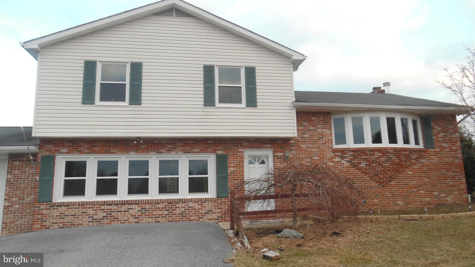 17913 Marshall Mill Road Hampstead, MD 21074 - Photo 2 of 16 a front view of a house with a yard