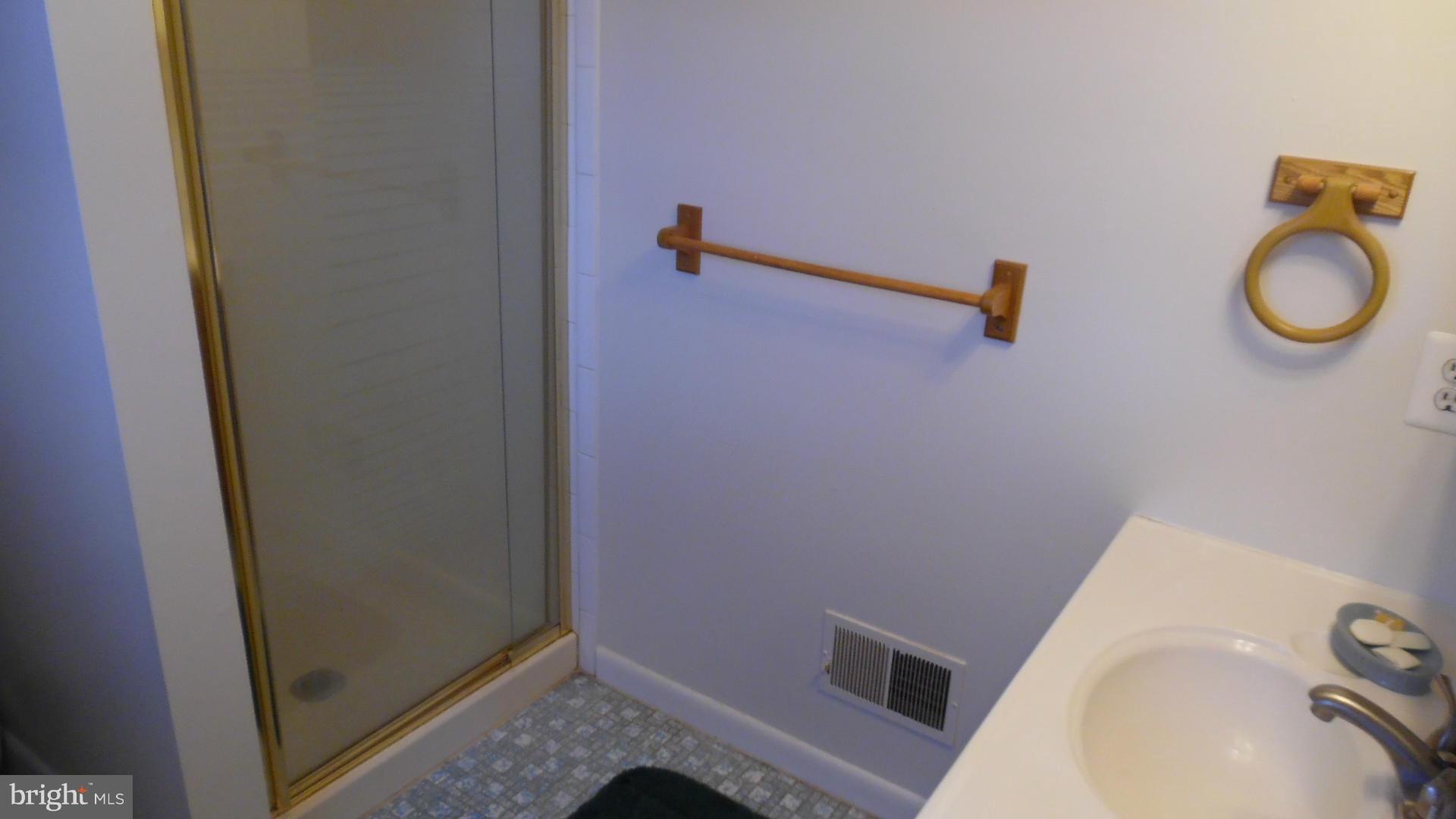 17913 Marshall Mill Road Hampstead, MD 21074 - Photo 14 of 16 a bathroom with a sink and mirror
