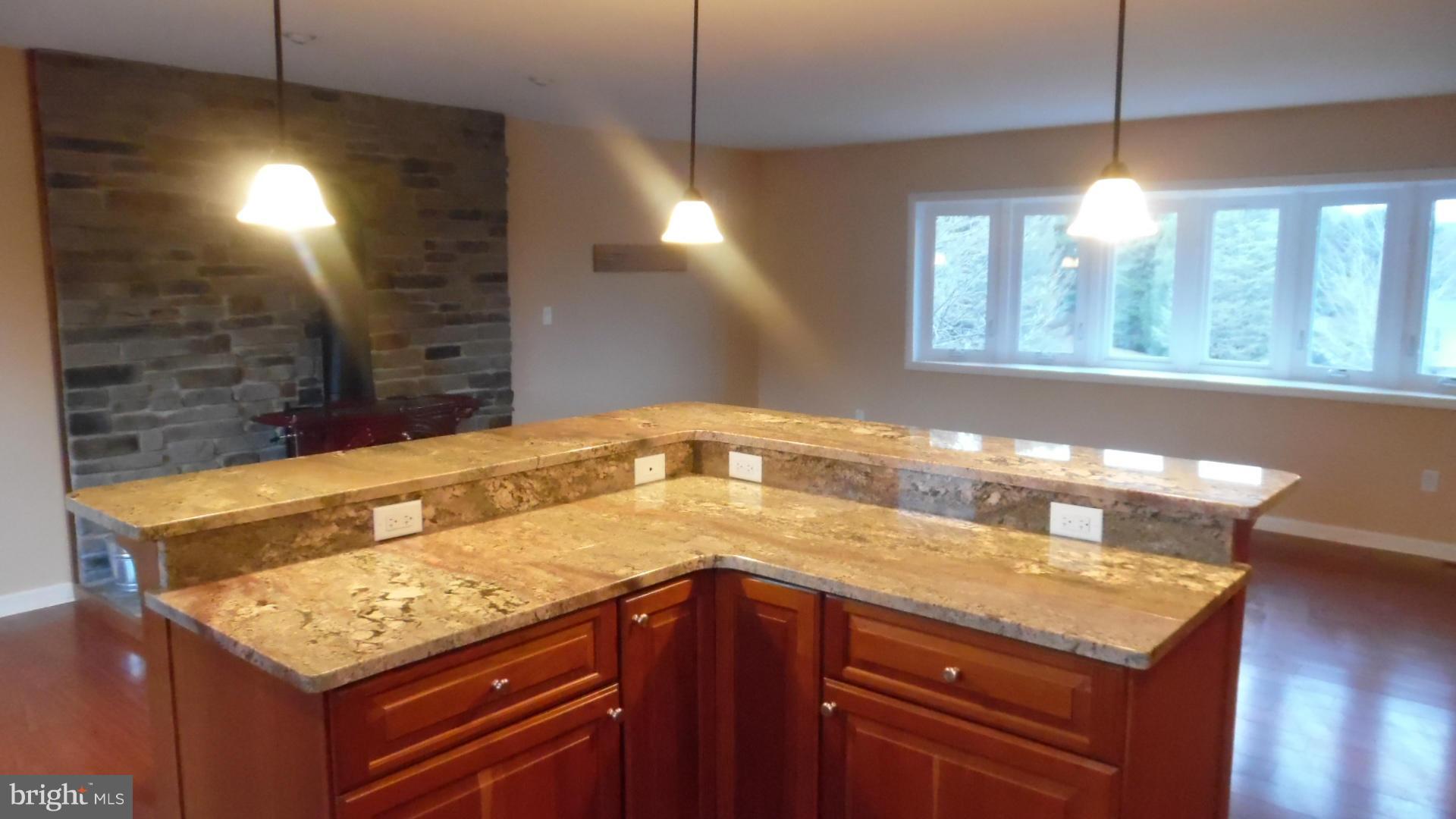17913 Marshall Mill Road Hampstead, MD 21074 - Photo 7 of 16 a kitchen with a sink a counter space and a window