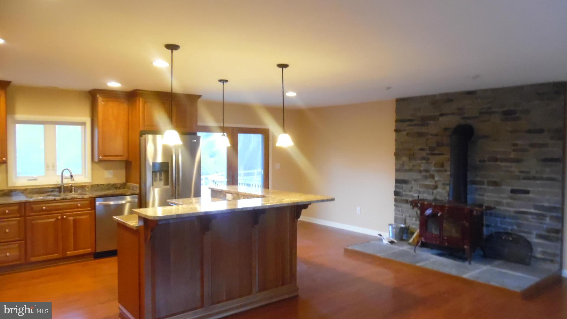 17913 Marshall Mill Road Hampstead, MD 21074 - Photo 10 of 16 a kitchen with a sink and a refrigerator