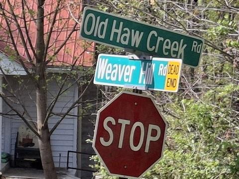 4 Weaver Hill Road Asheville, NC 28805 - Photo 6 of 11 a close up of a street sign