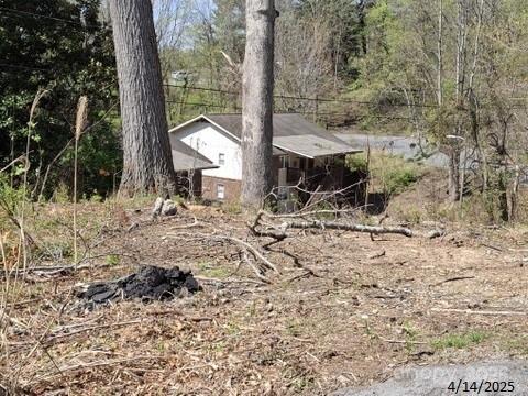 4 Weaver Hill Road Asheville, NC 28805 - Photo 9 of 11 a view of house with backyard space and sitting area
