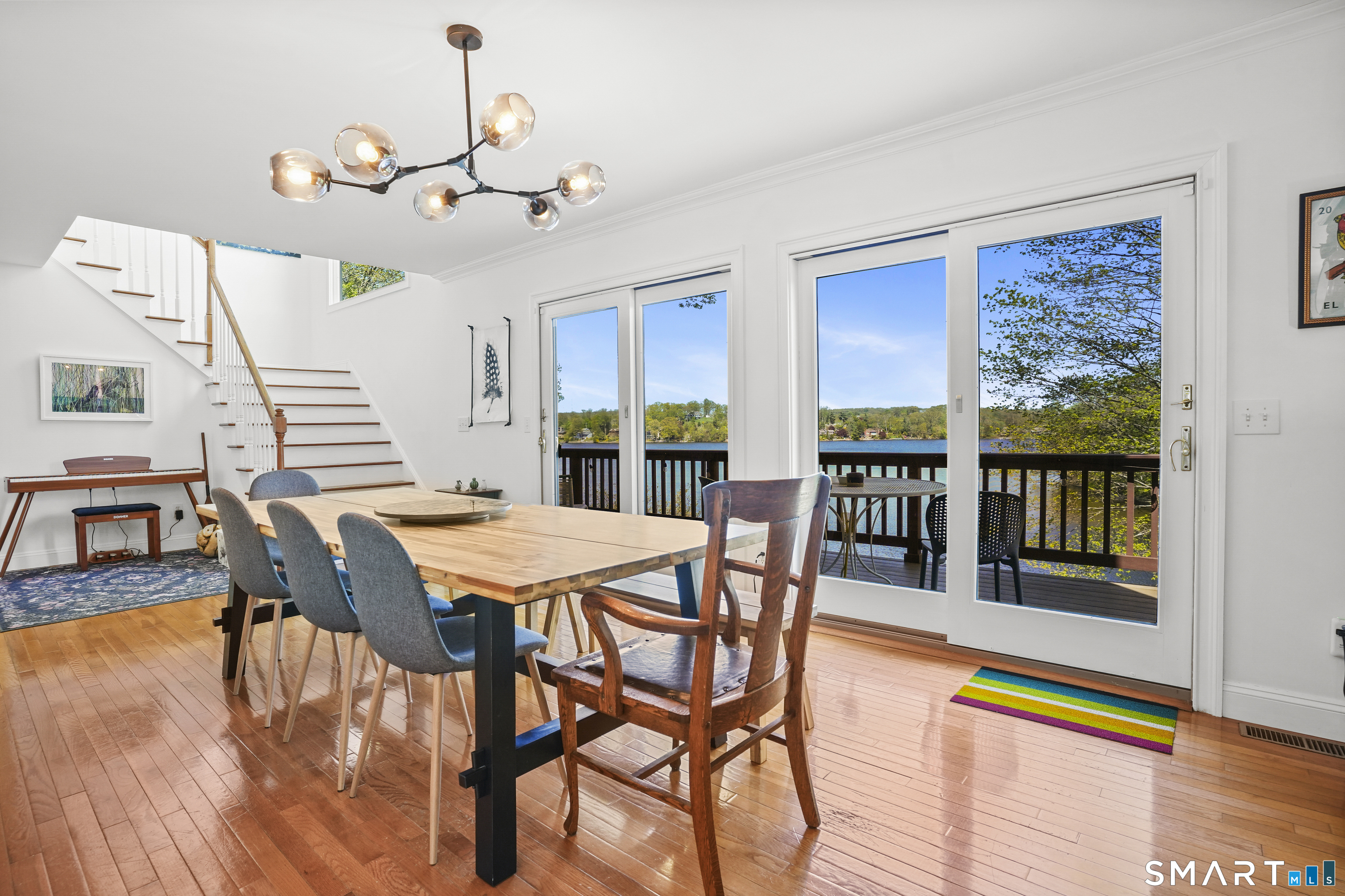 83 Wood Creek Road New Fairfield, CT 06812 - Photo 12 of 40 Dining room with deck access and lake views.