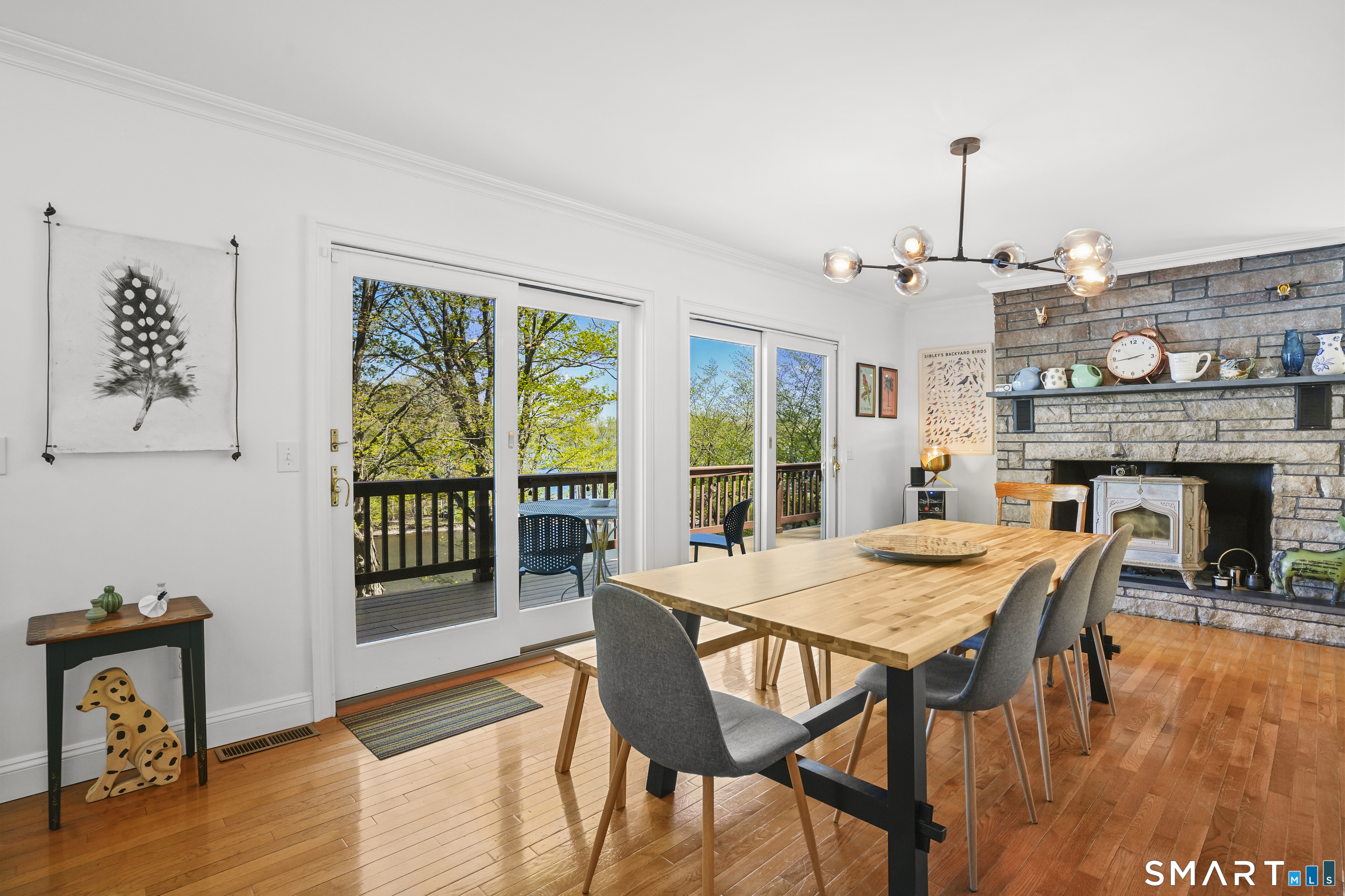 83 Wood Creek Road New Fairfield, CT 06812 - Photo 13 of 40 Dining room. Beautiful wood stove. Lake views.