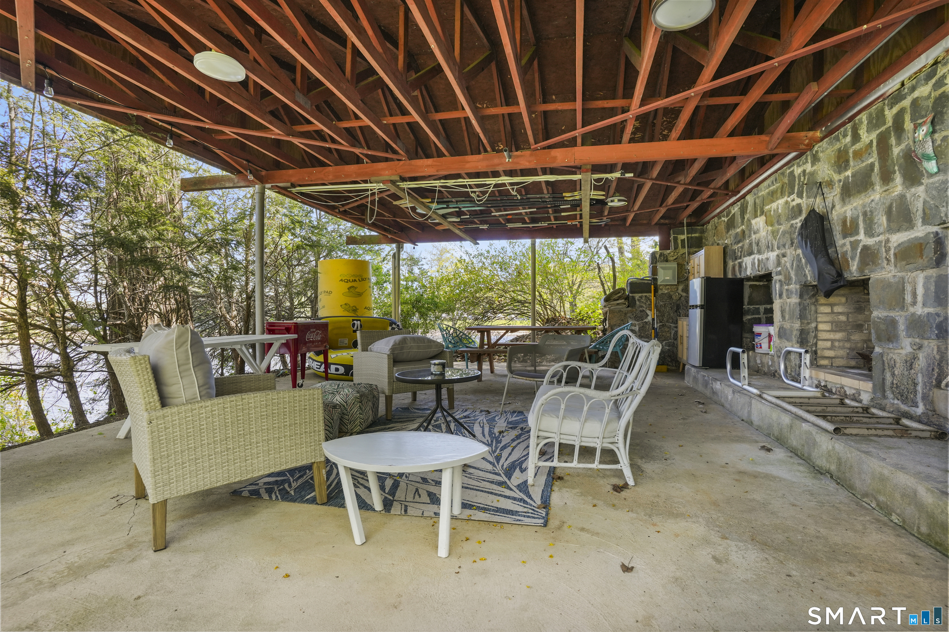 83 Wood Creek Road New Fairfield, CT 06812 - Photo 32 of 40 Enjoy and entertain in your pavilion, rain or shine, right next to the water complete with fridge and wood fireplace.