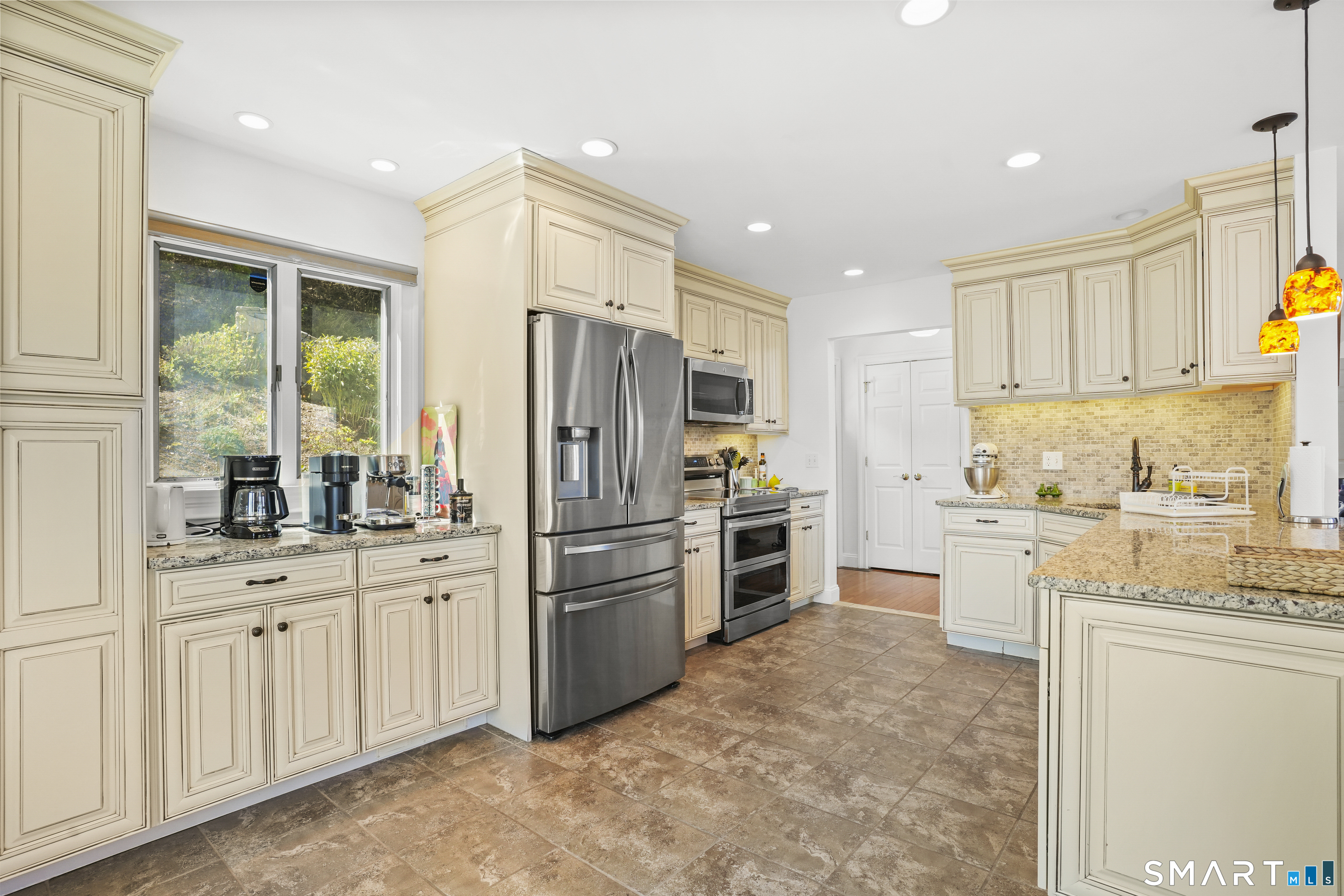 83 Wood Creek Road New Fairfield, CT 06812 - Photo 10 of 40 Nicely updated kitchen with granite counters, stainless steel appliances and tile floor.