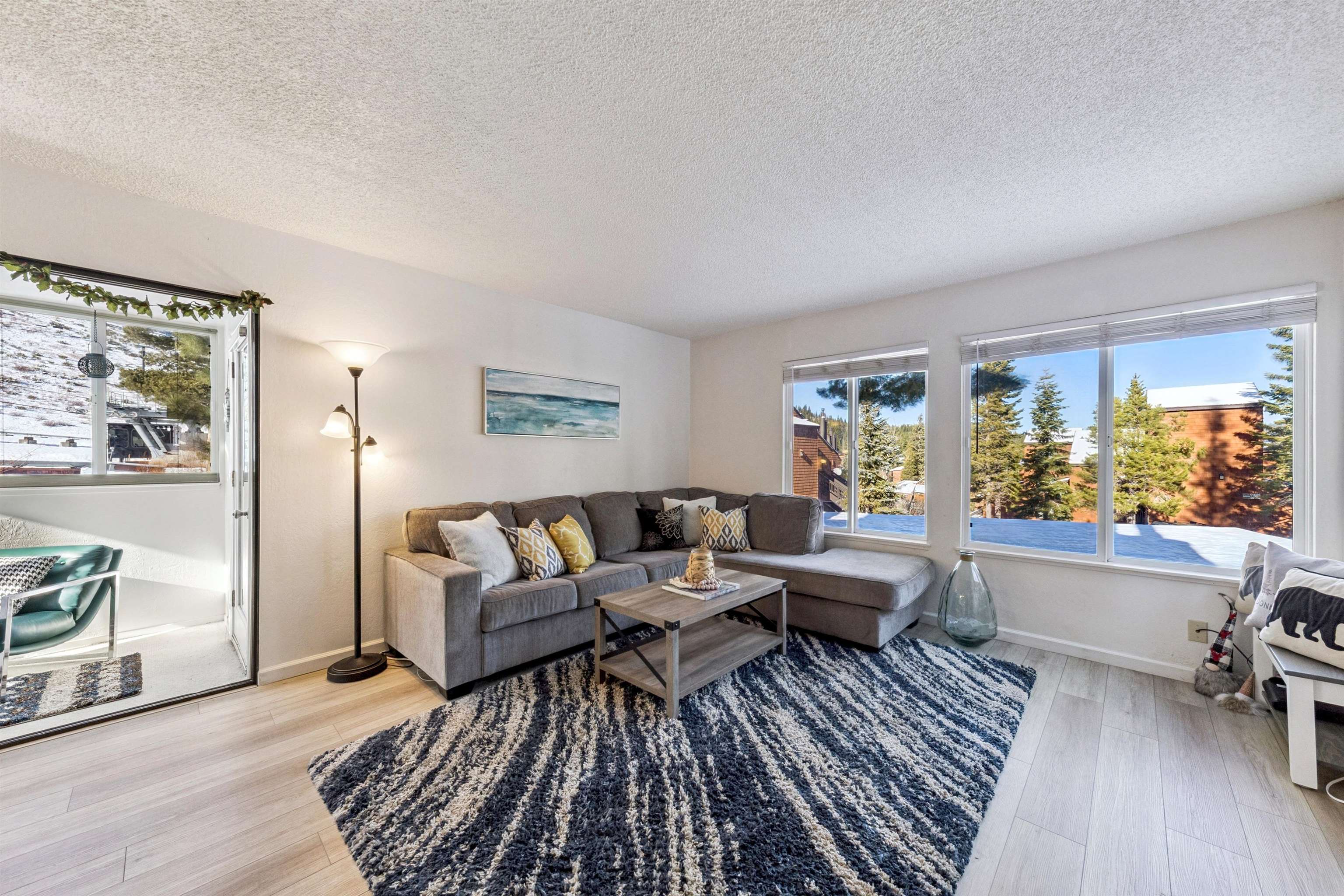 11727 Snowpeak Way, Unit 574 Truckee, CA 96161 - Photo 4 of 15 a living room with furniture and a large window