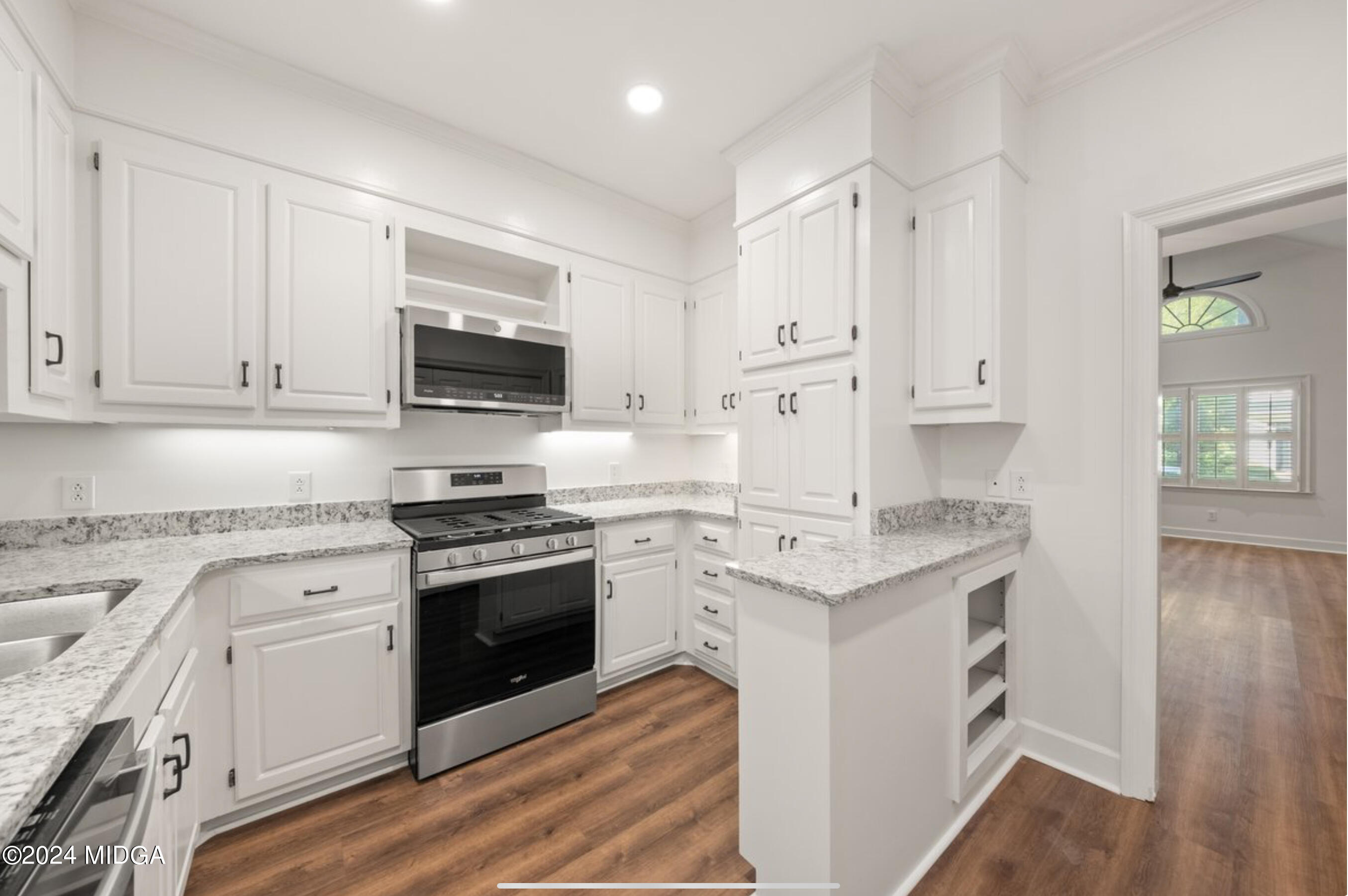 154 Lokchapee Landing Macon, GA 31210 - Photo 12 of 29 a kitchen with stainless steel appliances granite countertop a stove and a sink