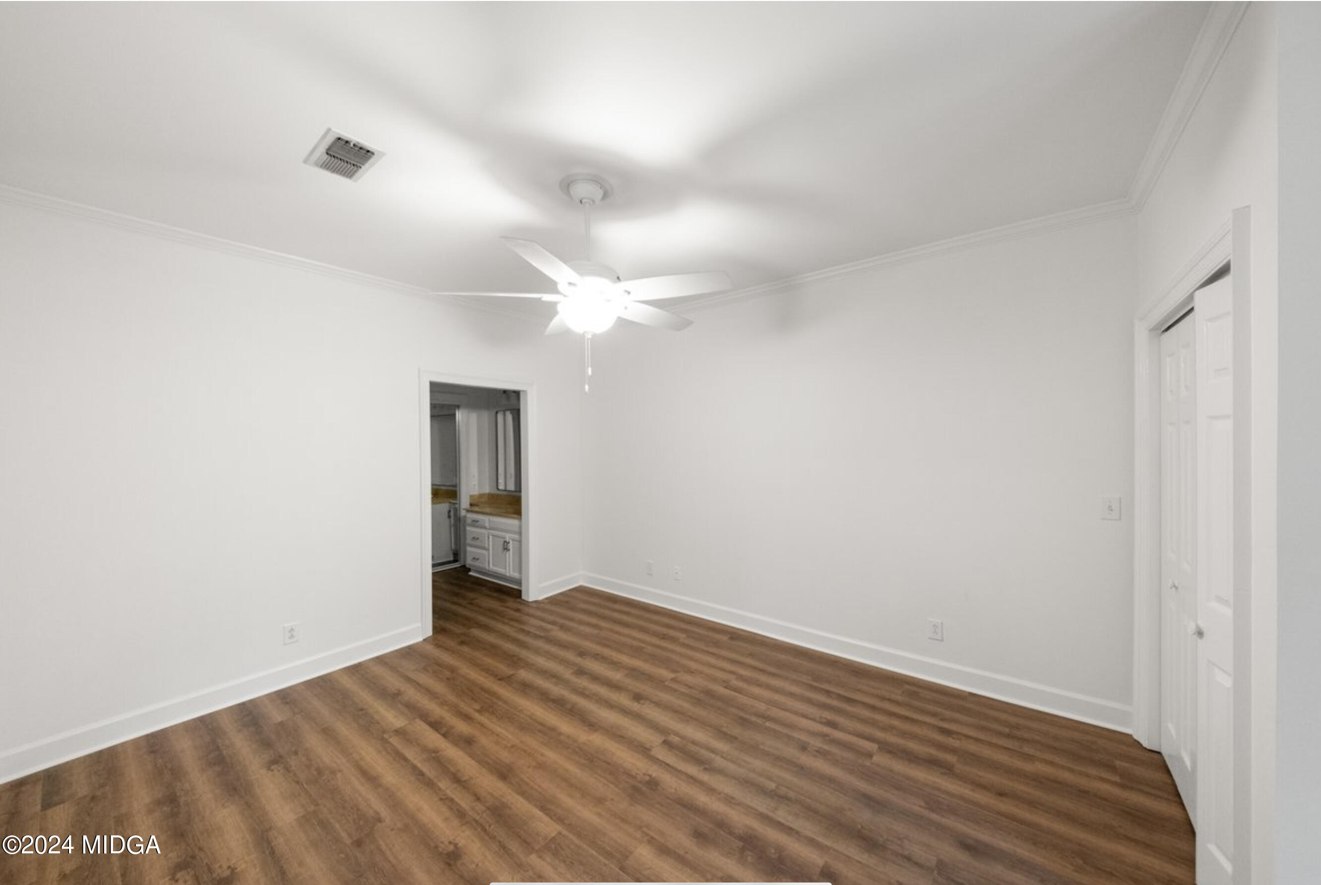 154 Lokchapee Landing Macon, GA 31210 - Photo 17 of 29 a view of an empty room with wooden floor