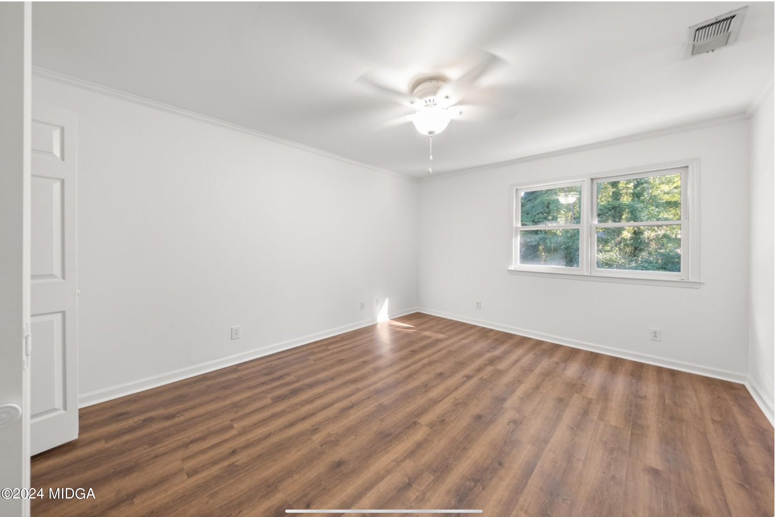 154 Lokchapee Landing Macon, GA 31210 - Photo 25 of 29 an empty room with wooden floor and windows