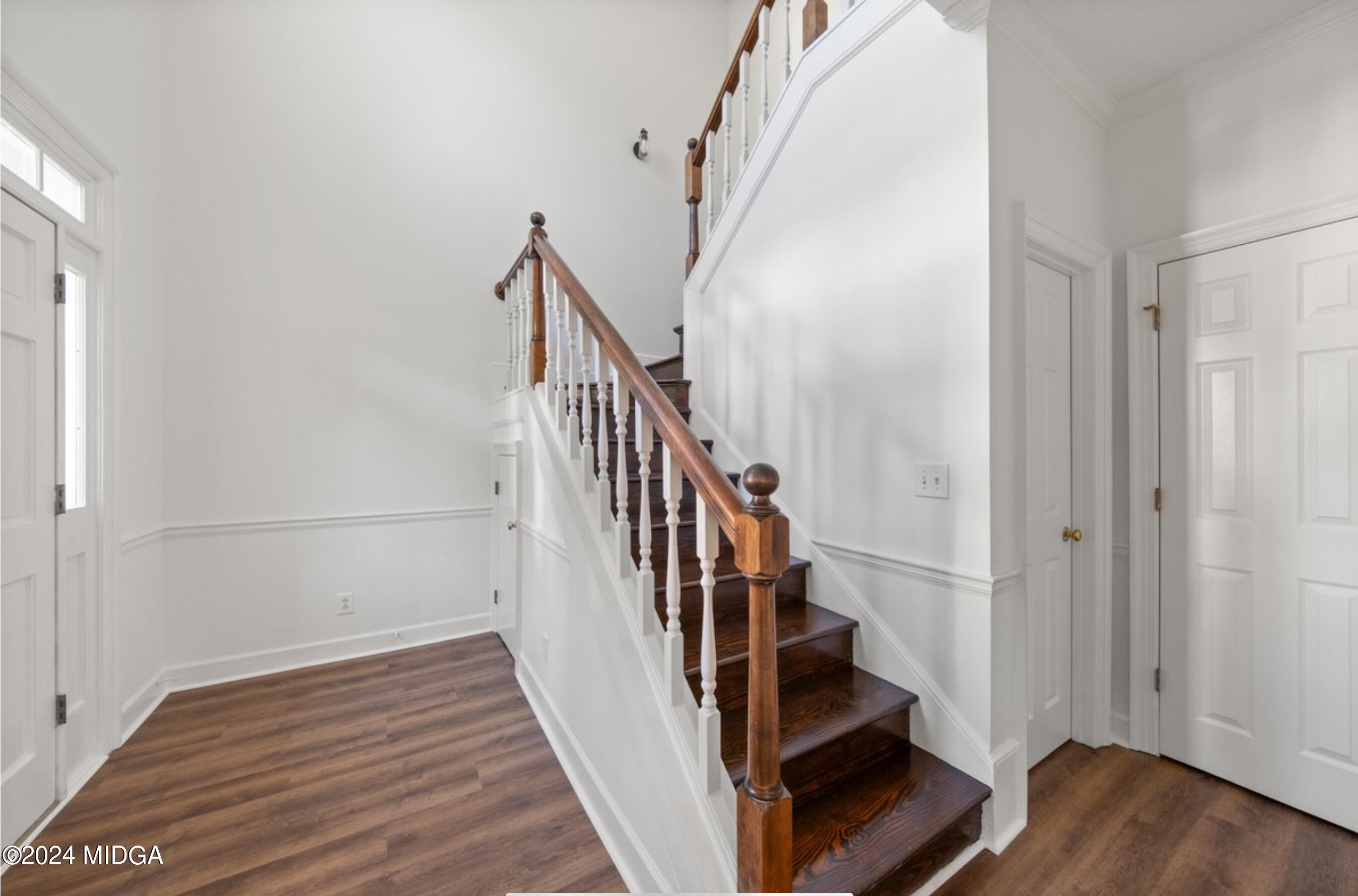 154 Lokchapee Landing Macon, GA 31210 - Photo 4 of 29 a view of staircase with wooden floor and white walls