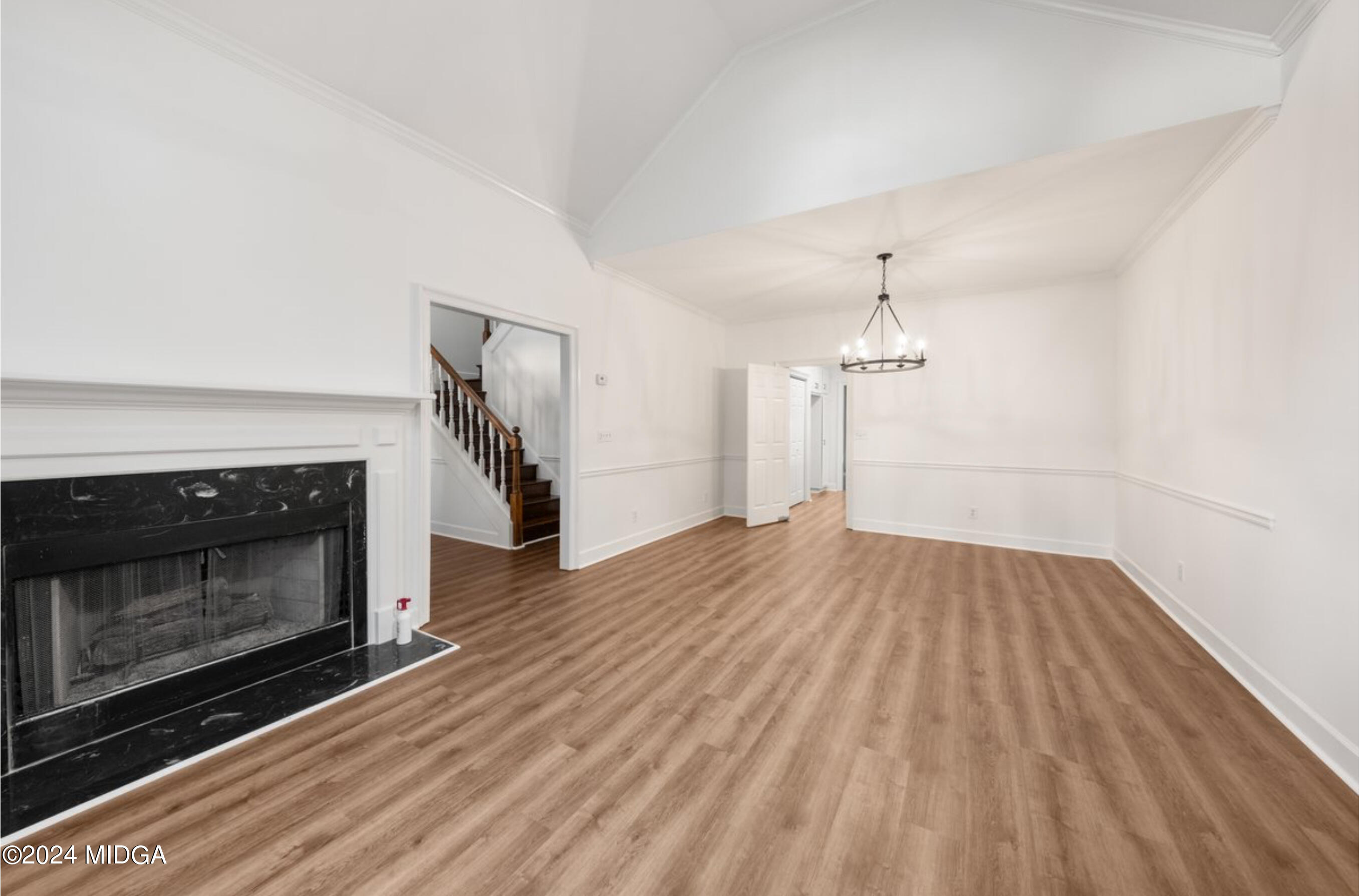 154 Lokchapee Landing Macon, GA 31210 - Photo 5 of 29 a view of empty room with wooden floor and fireplace