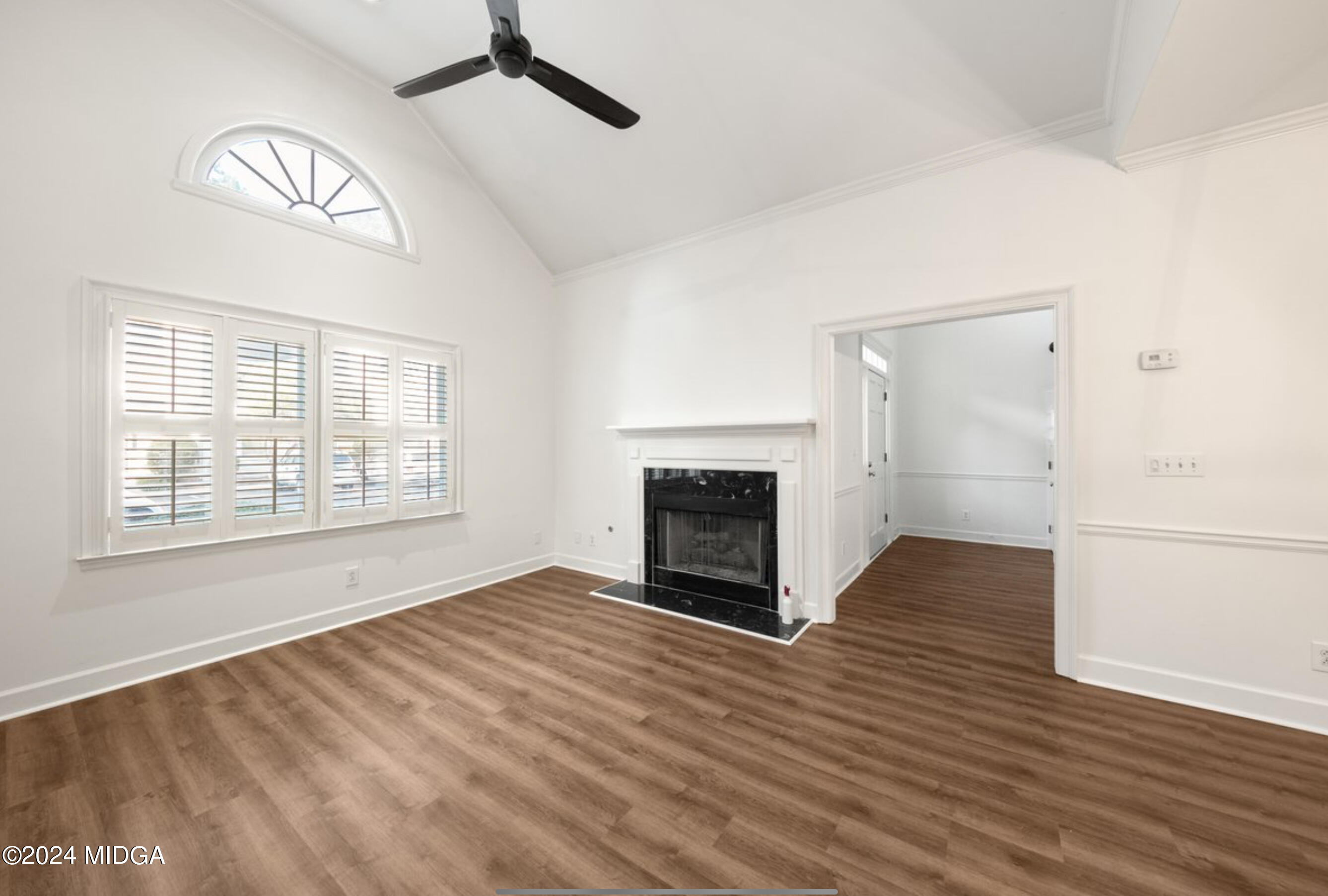 154 Lokchapee Landing Macon, GA 31210 - Photo 6 of 29 a view of empty room with wooden floor and fireplace