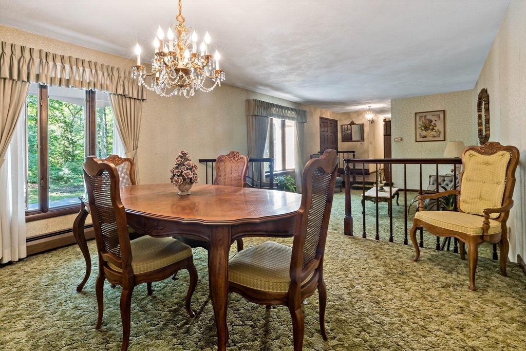26 Danforth Street Rehoboth, MA 02769 - Photo 17 of 30 a view of a dining room with furniture a chandelier and wooden floor
