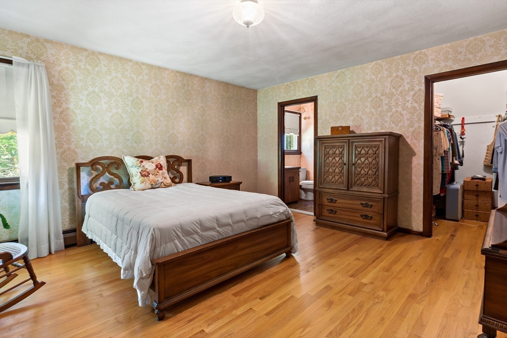 26 Danforth Street Rehoboth, MA 02769 - Photo 19 of 30 a bed sitting in a bedroom next to a window