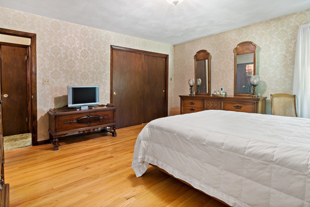 26 Danforth Street Rehoboth, MA 02769 - Photo 21 of 30 a bedroom with a bed and a flat screen tv