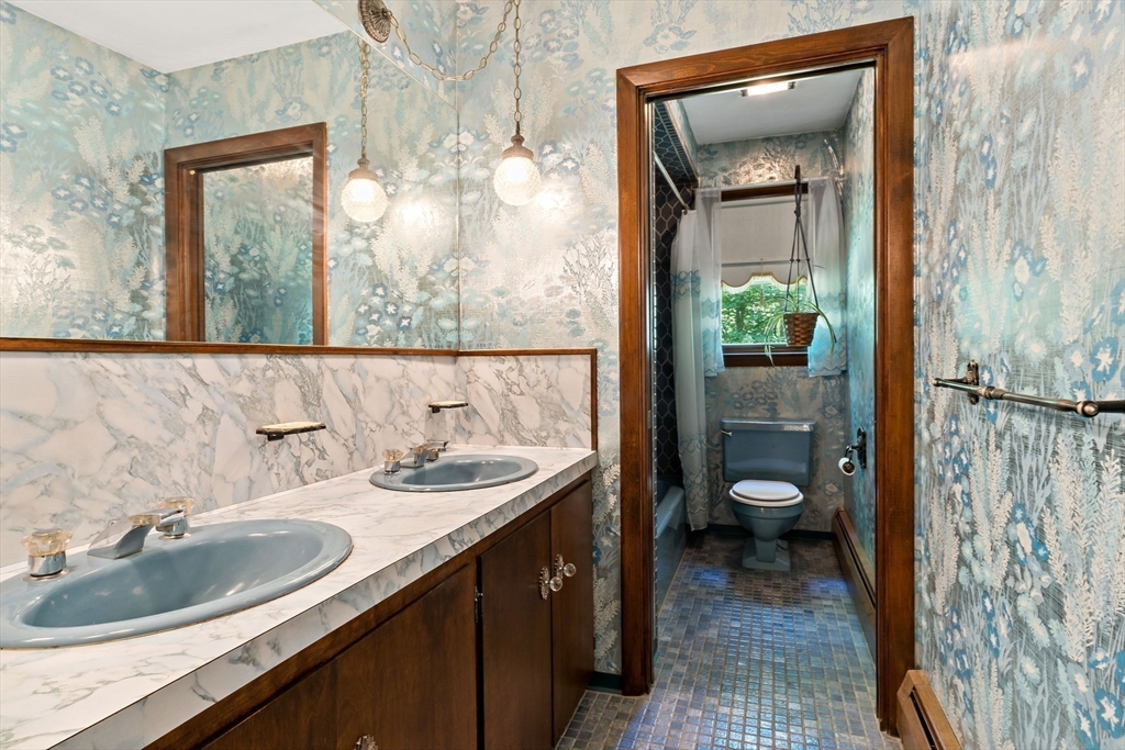 26 Danforth Street Rehoboth, MA 02769 - Photo 22 of 30 a bathroom with a sink and a mirror