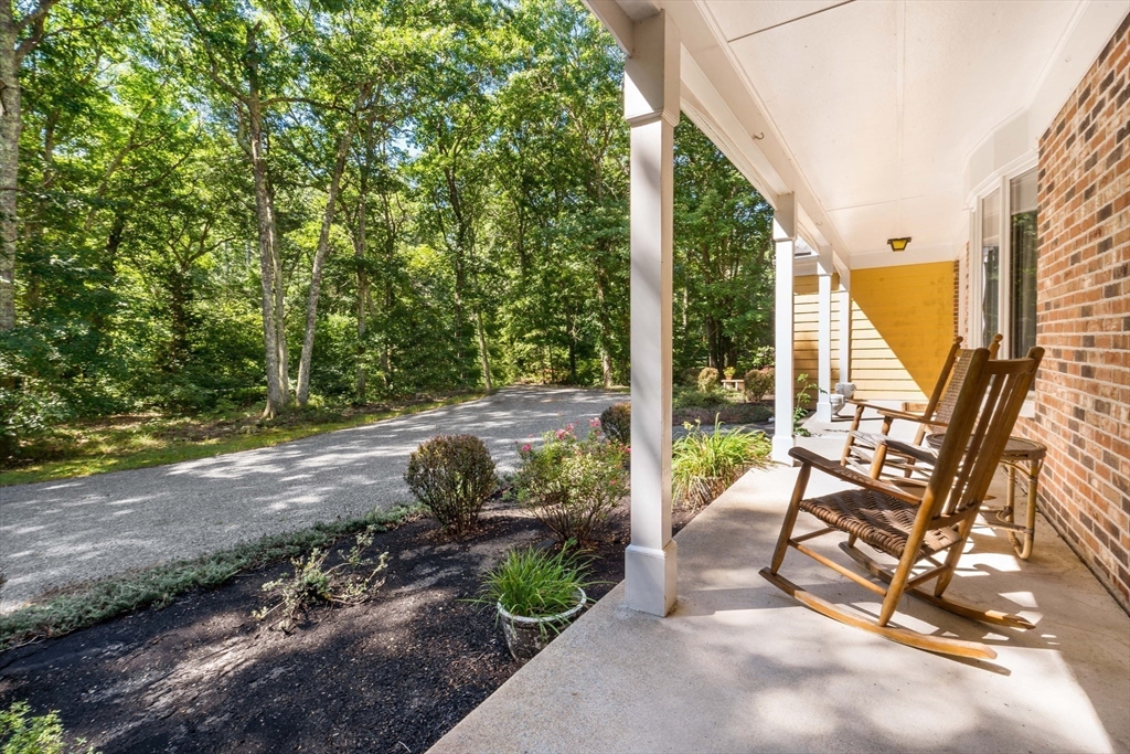 26 Danforth Street Rehoboth, MA 02769 - Photo 29 of 30 a view of a patio with table and chairs next to a yard