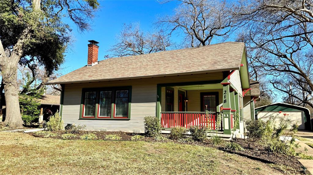 218 Elm Drive Terrell, TX 75160 - Photo 1 of 27 a front view of a house with a yard