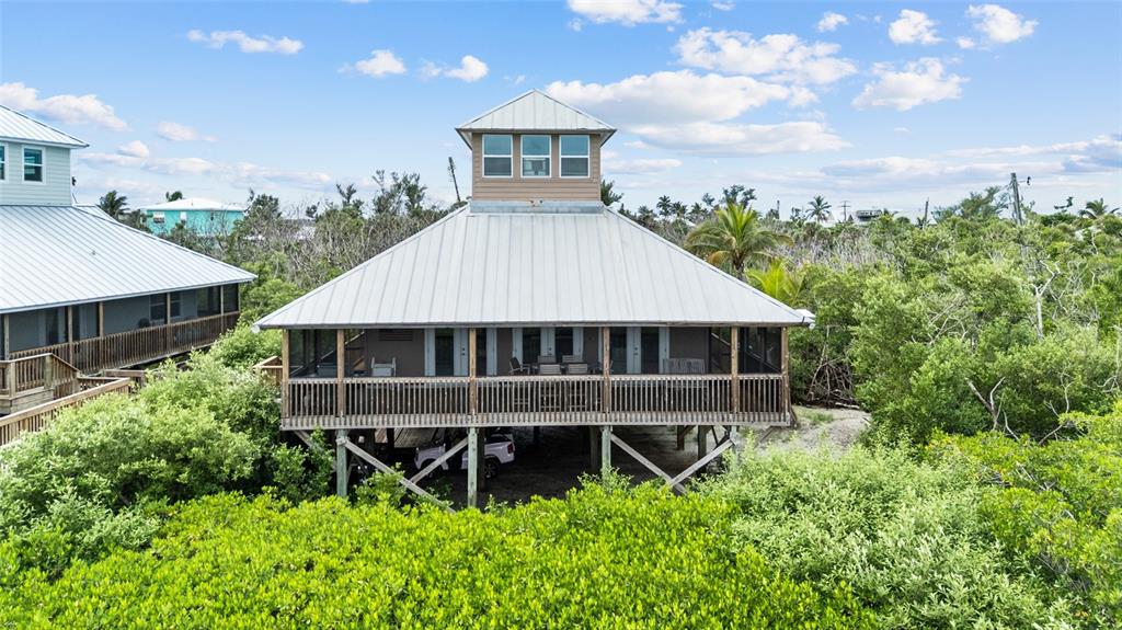 aerial view of a house with balcony and garden