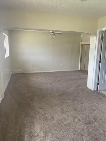 an empty room with a fireplace
