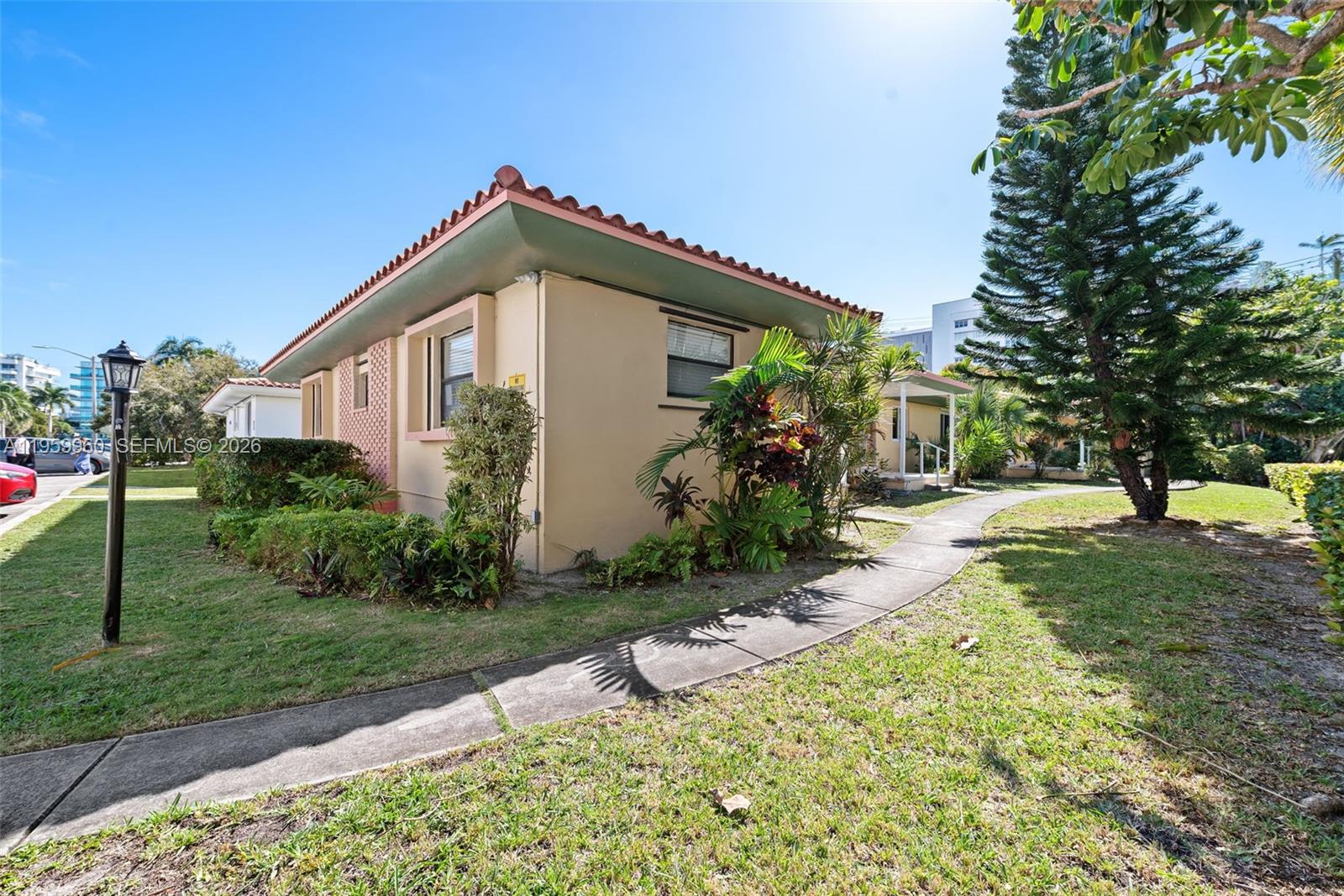1082 92nd Street, Unit 2 Bay Harbor Islands, FL 33154 - Photo 17 of 19 a view of a backyard with plants