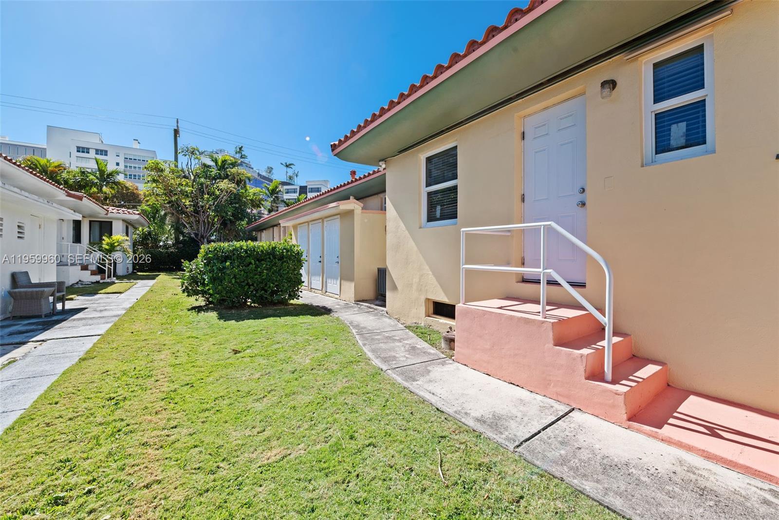 1082 92nd Street, Unit 2 Bay Harbor Islands, FL 33154 - Photo 18 of 19 a swimming pool with yard and outdoor seating