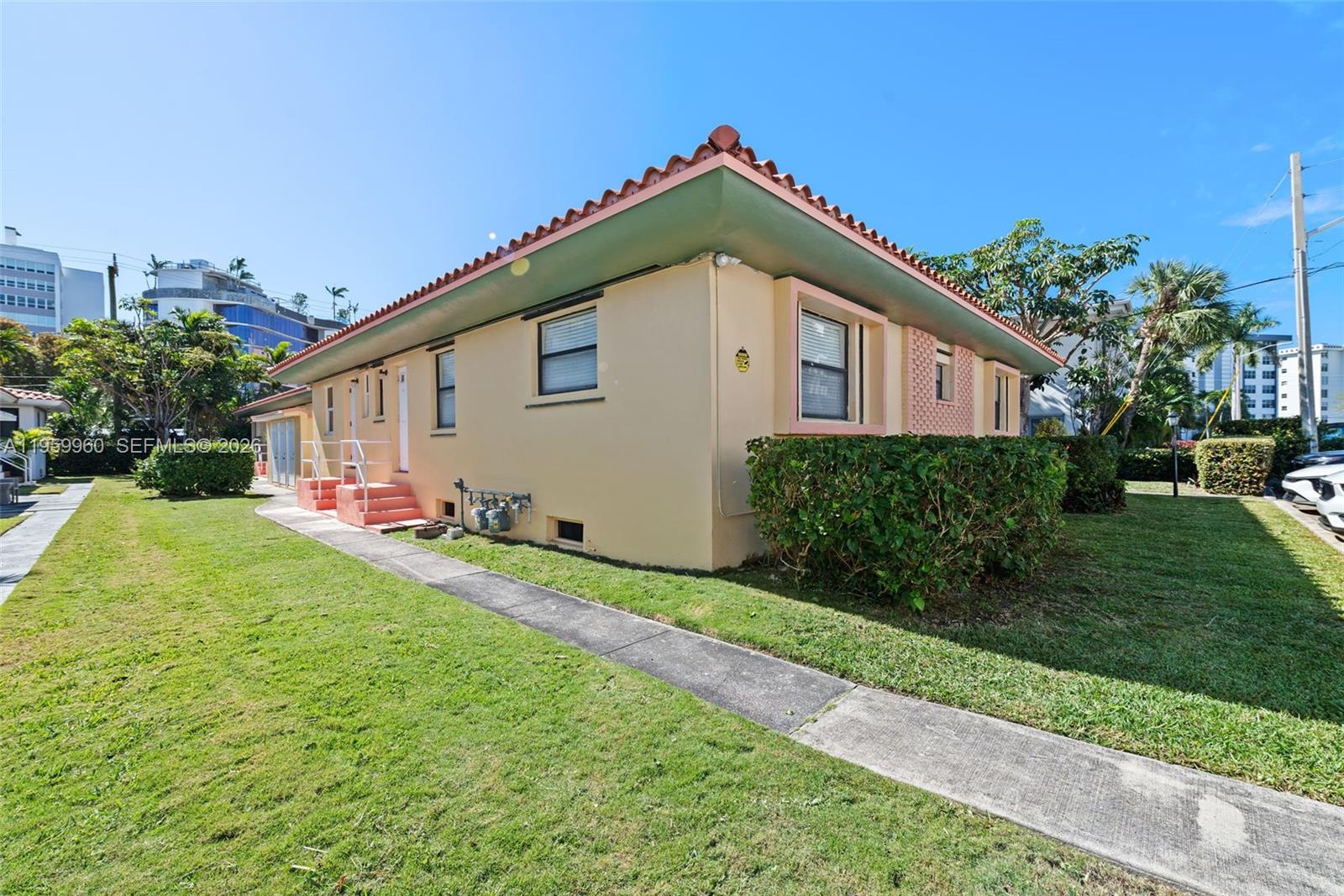1082 92nd Street, Unit 2 Bay Harbor Islands, FL 33154 - Photo 19 of 19 a front view of house with yard and green space