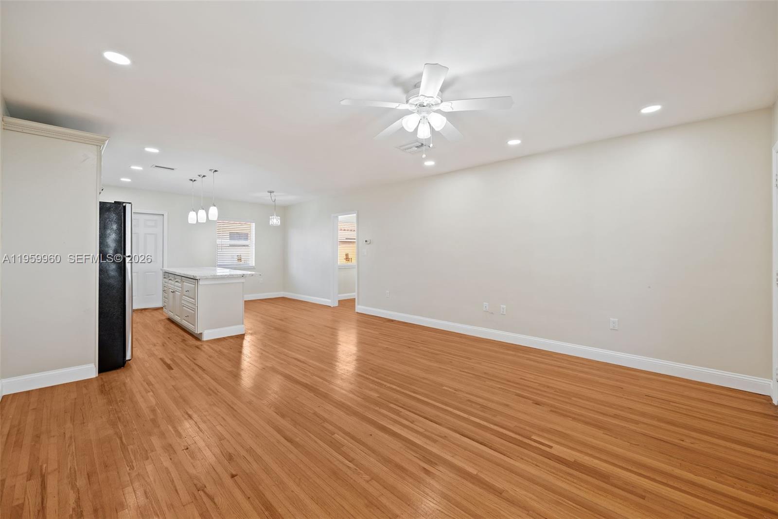 1082 92nd Street, Unit 2 Bay Harbor Islands, FL 33154 - Photo 7 of 19 a view of an empty room with wooden floor