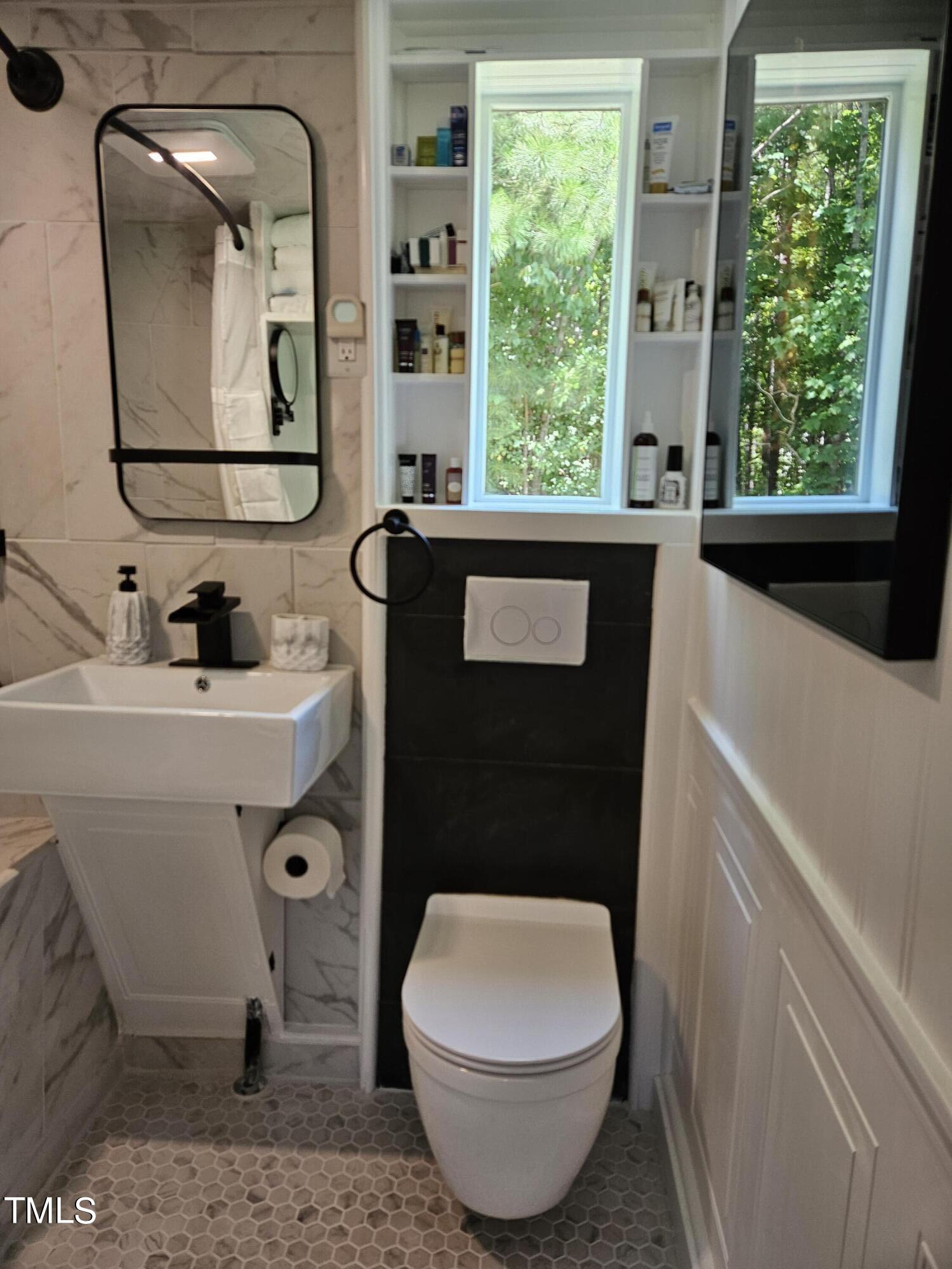 3081 Jacksontown Road Manson, NC 27553 - Photo 13 of 39 a bathroom with a toilet sink and mirror