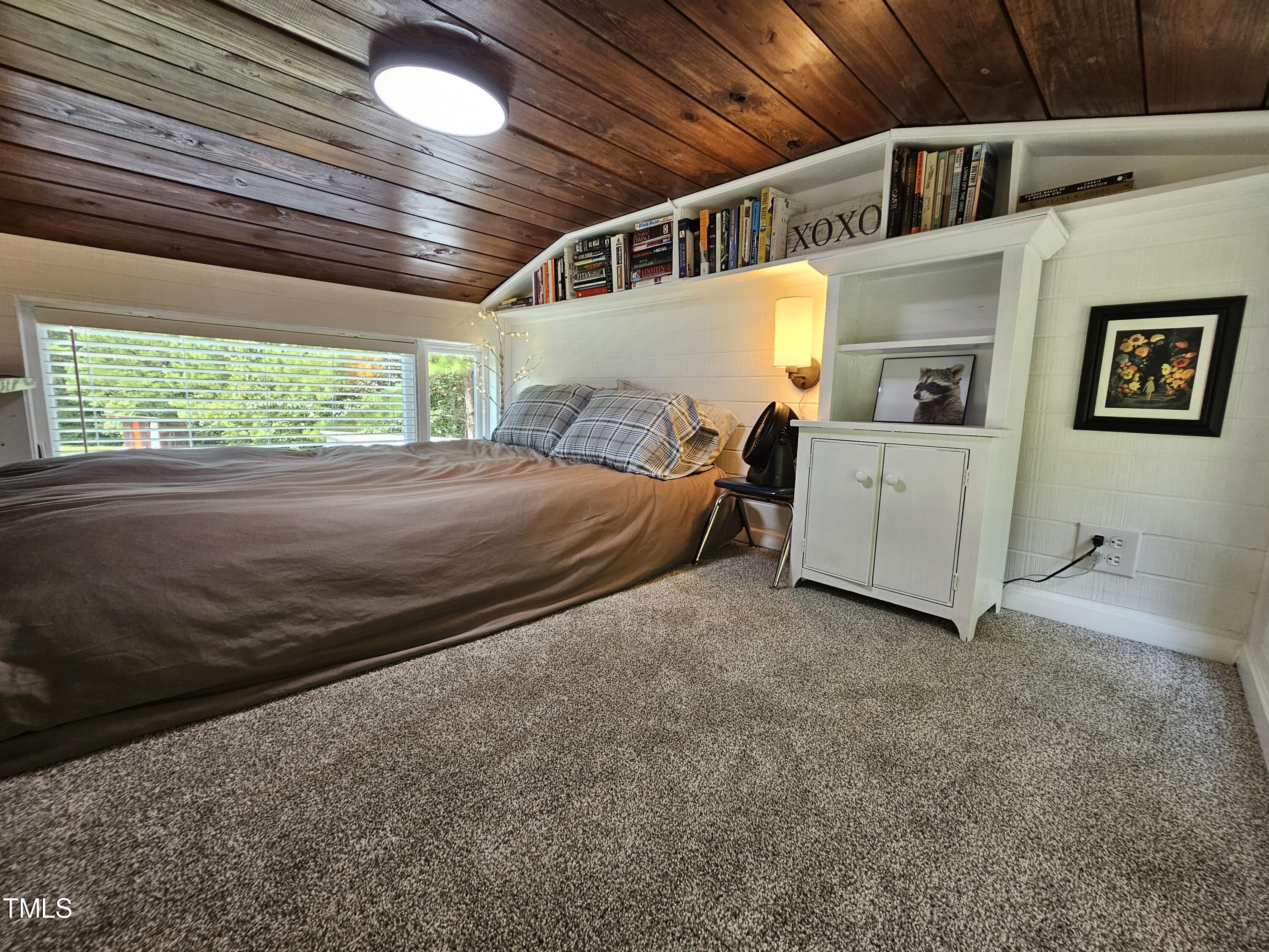 3081 Jacksontown Road Manson, NC 27553 - Photo 16 of 39 a spacious bedroom with a bed and a large window
