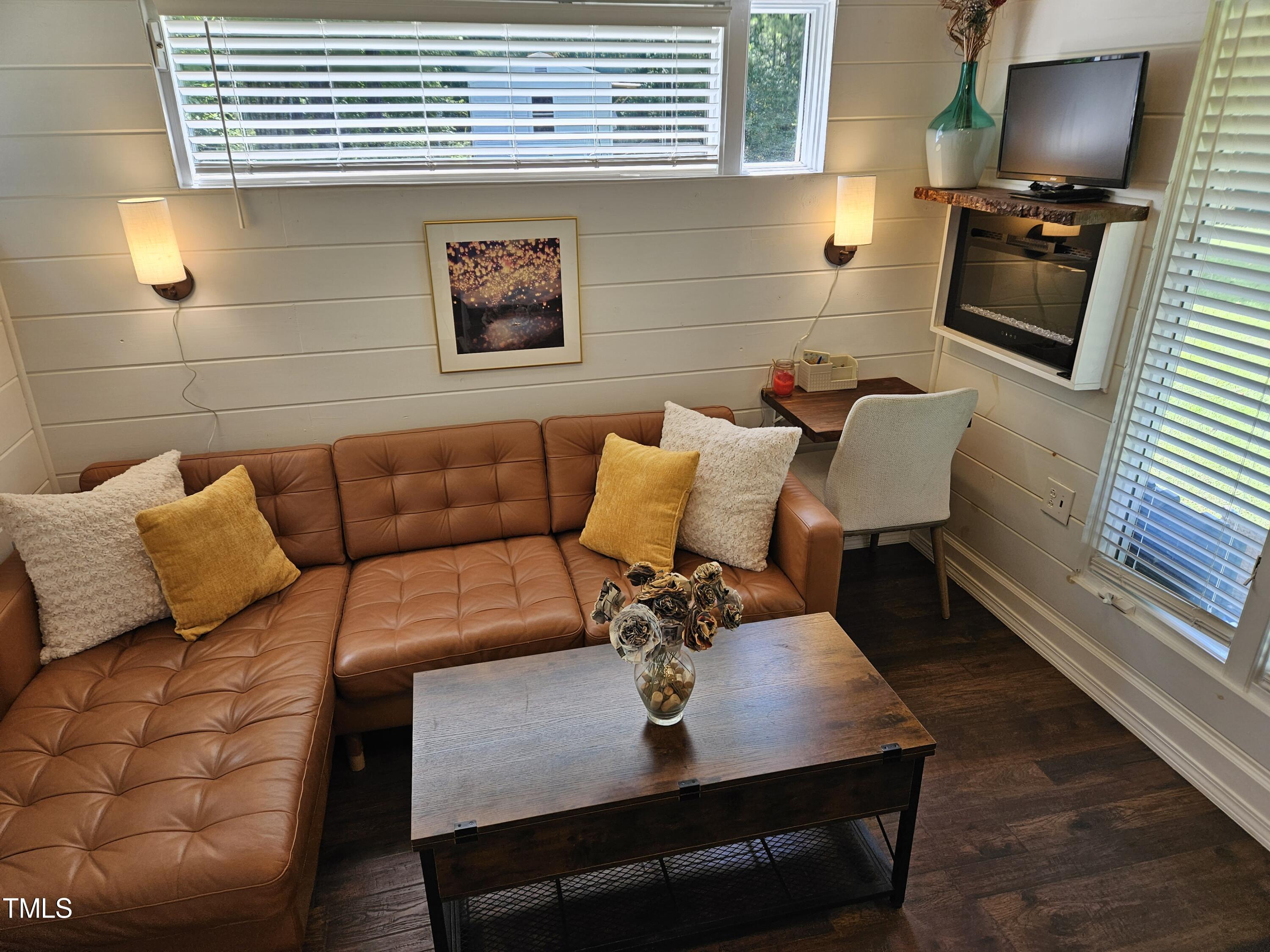 3081 Jacksontown Road Manson, NC 27553 - Photo 9 of 39 a view of a living room with furniture and a flat screen tv