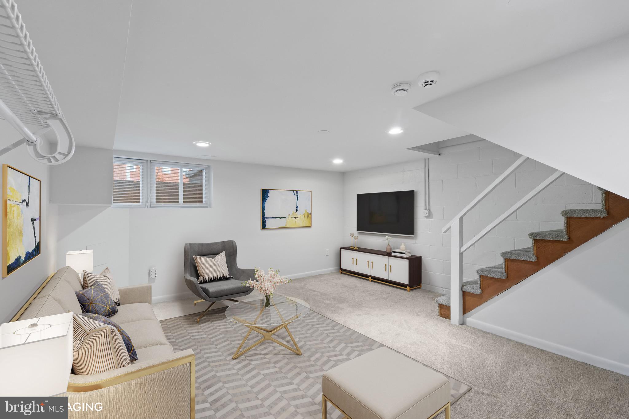 8146 Del Haven Road Baltimore, MD 21222 - Photo 18 of 35 a living room with furniture and a flat screen tv