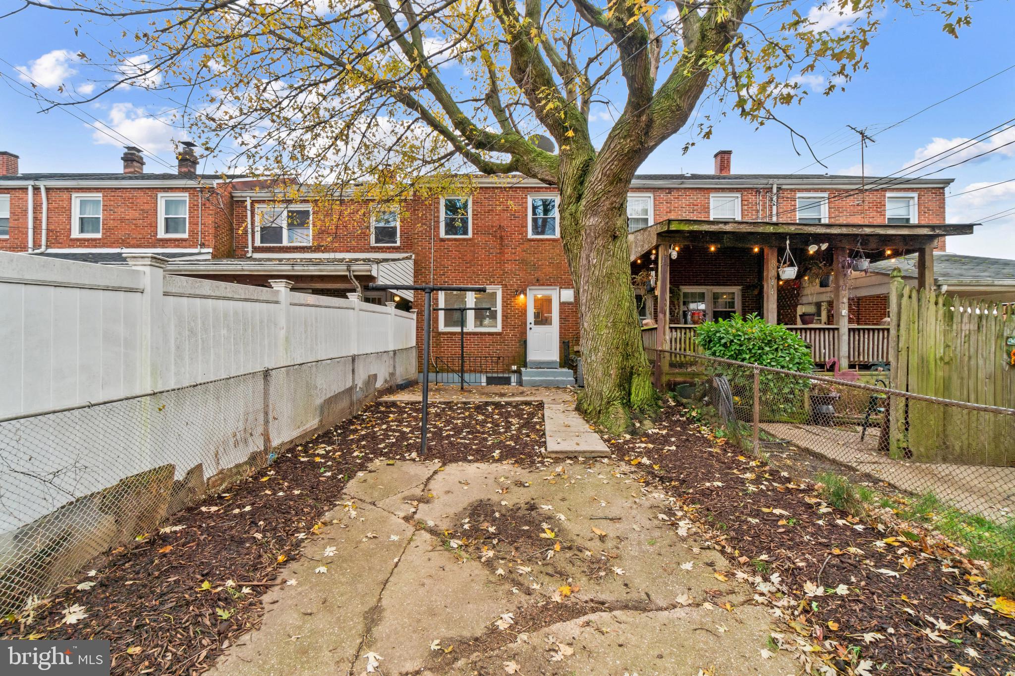 8146 Del Haven Road Baltimore, MD 21222 - Photo 24 of 35 a view of a chairs and table in the backyard