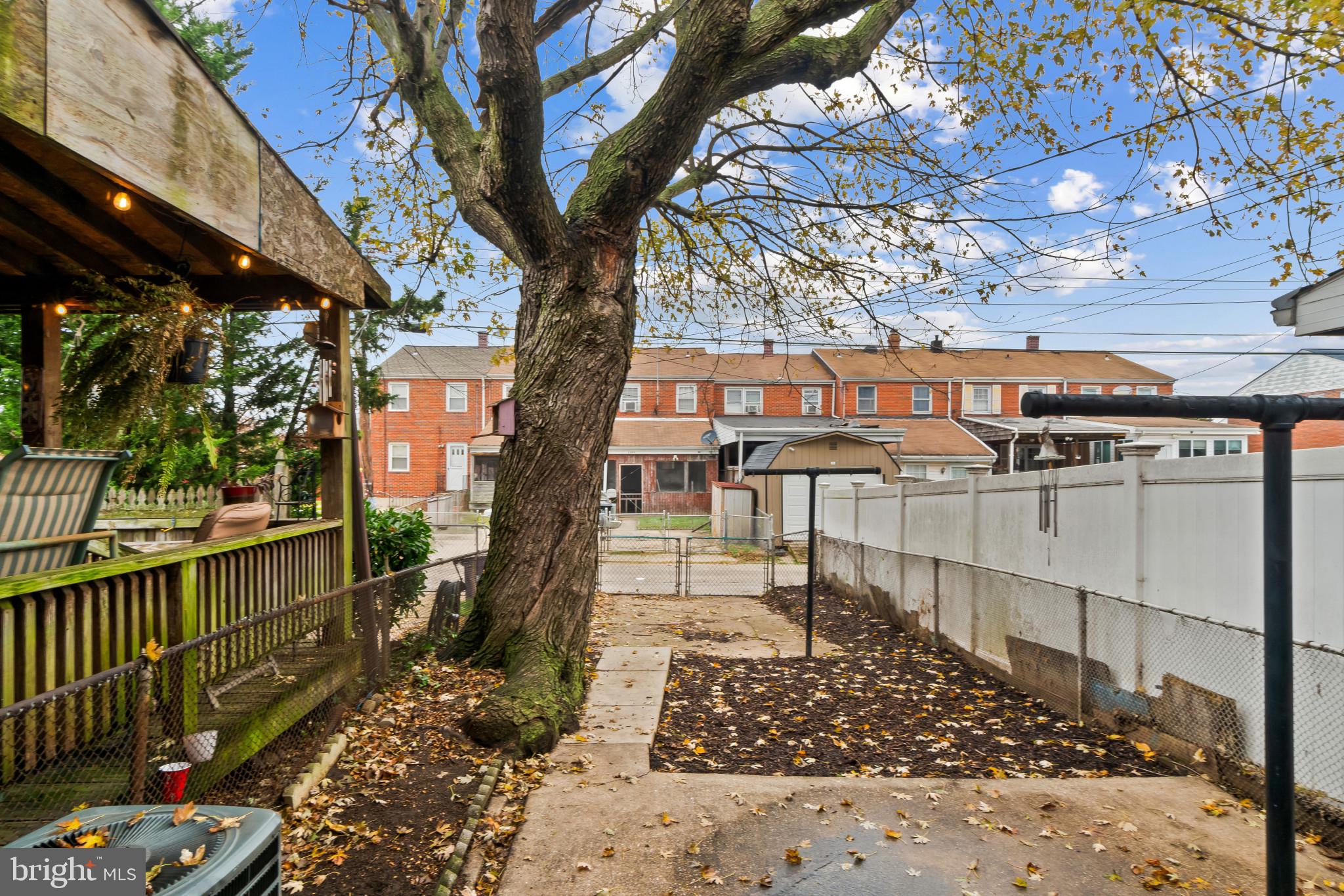 8146 Del Haven Road Baltimore, MD 21222 - Photo 25 of 35 a view of a pathway with a cars park side of a road