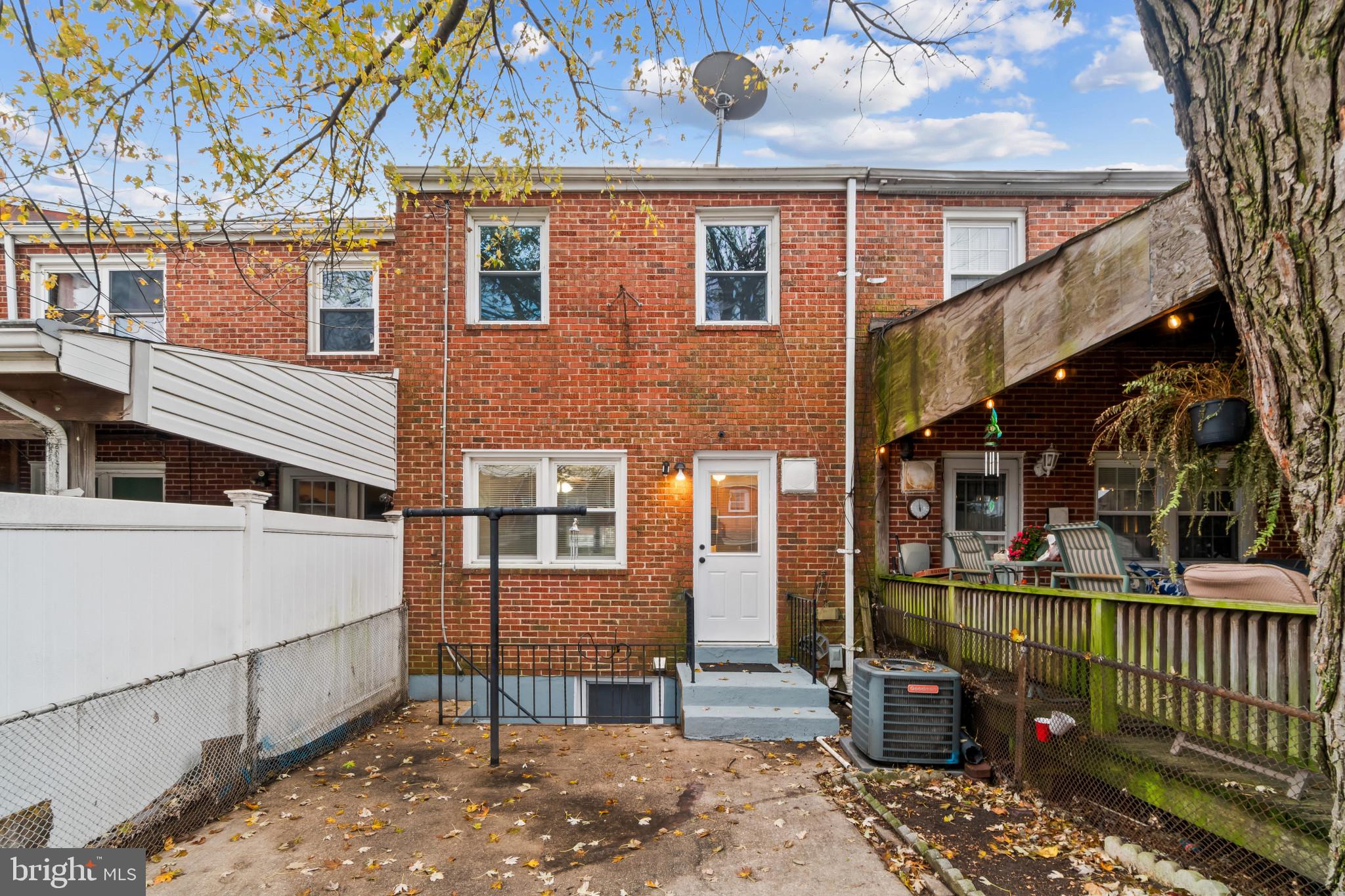 8146 Del Haven Road Baltimore, MD 21222 - Photo 26 of 35 a view of a brick house with large windows