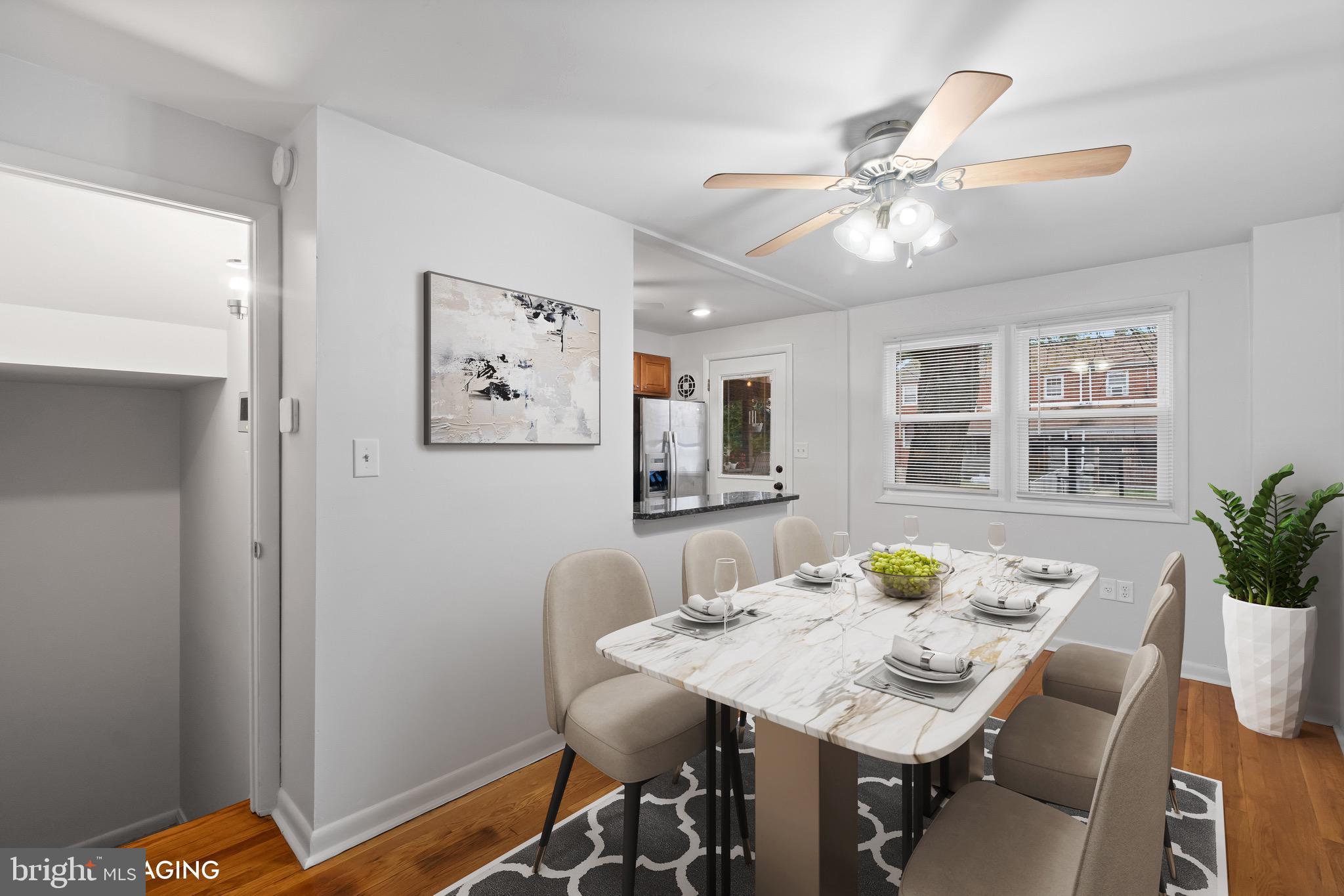 8146 Del Haven Road Baltimore, MD 21222 - Photo 6 of 35 a view of a dining room with furniture and window
