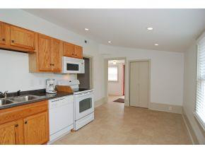 5001 Green Riley Road Rougemont, NC 27572 - Photo 8 of 23 a kitchen with granite countertop a sink stove and cabinets